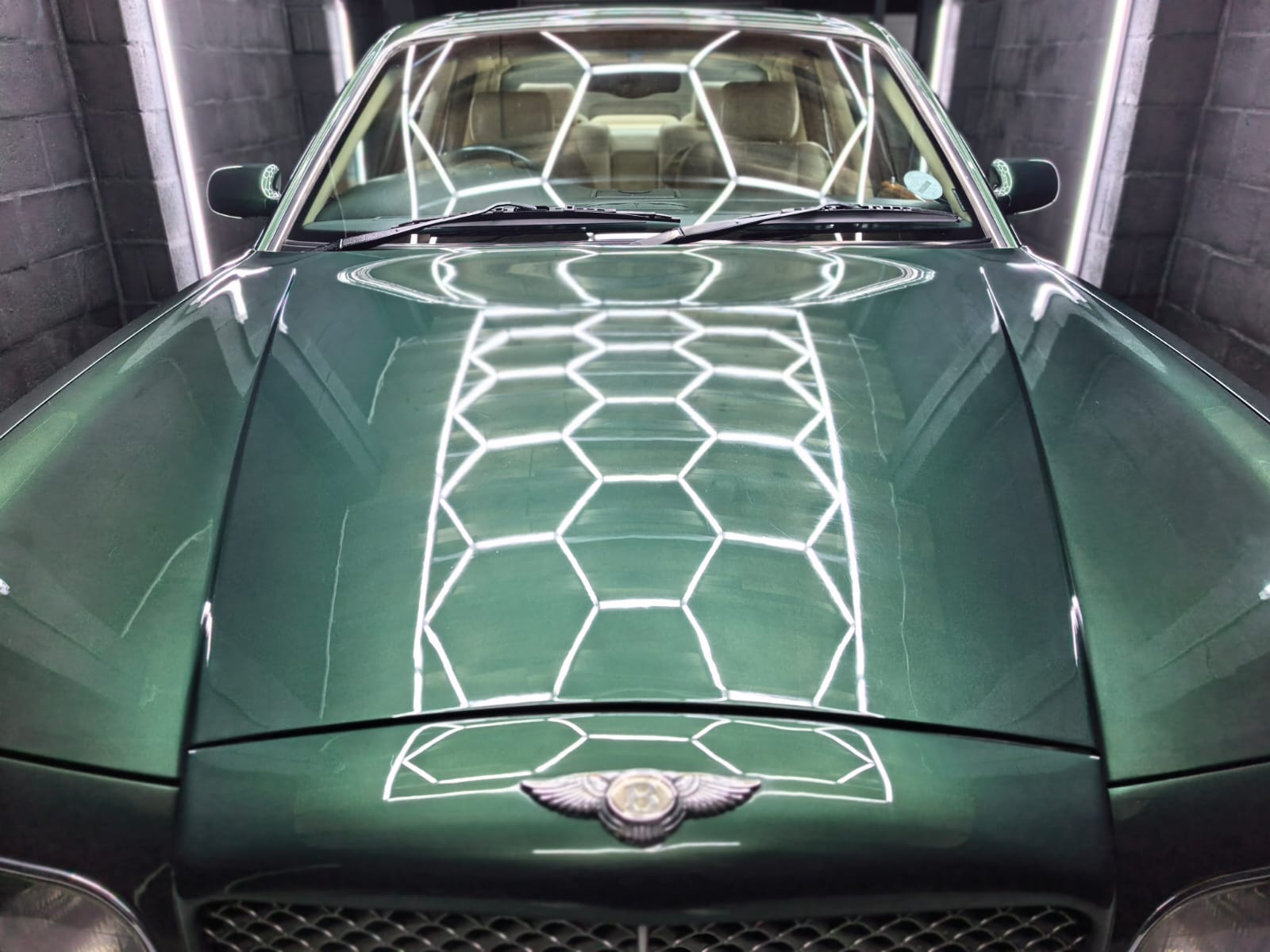Green Bentley paintwork after machine polishing and ceramic coating