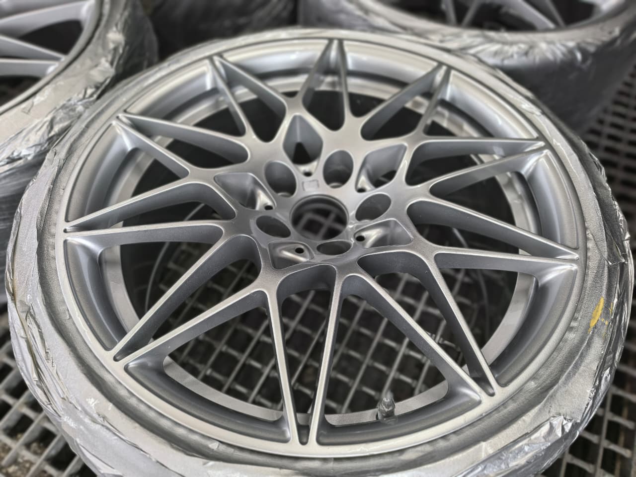 Silver alloy wheel after mag wheel restoration at AutoHub