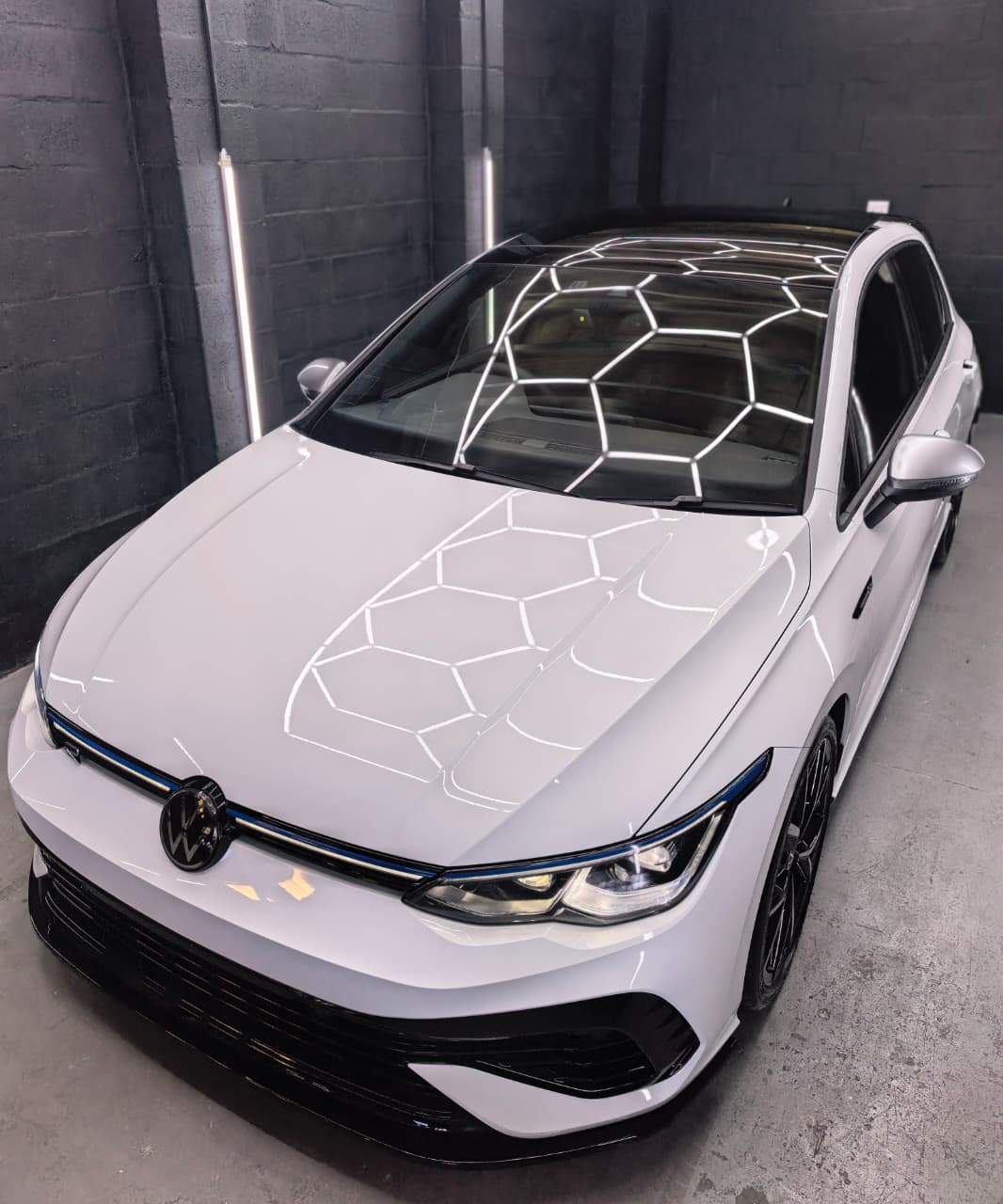 White Volkswagen front angle after detailing