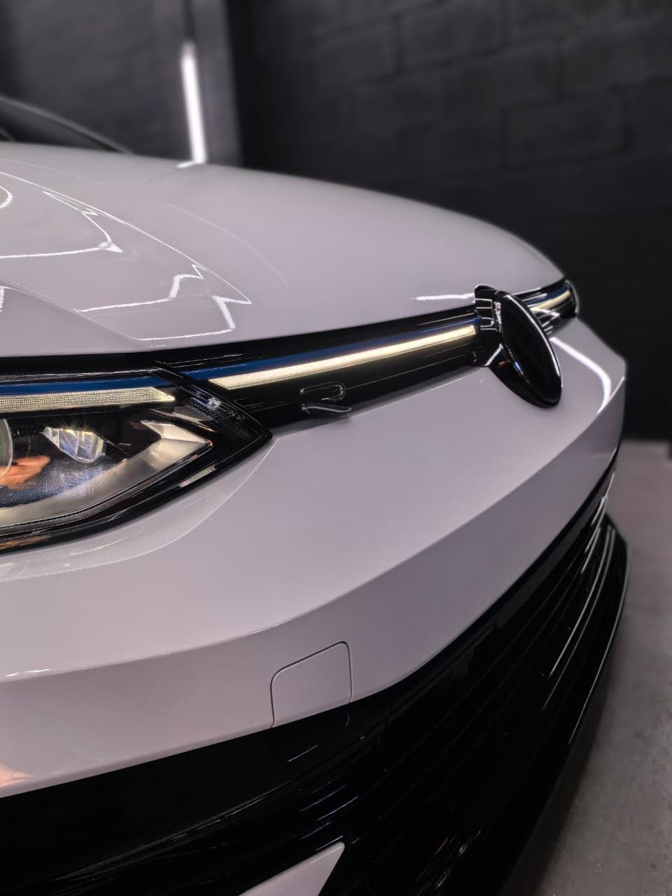 White Volkswagen headlight after restoration