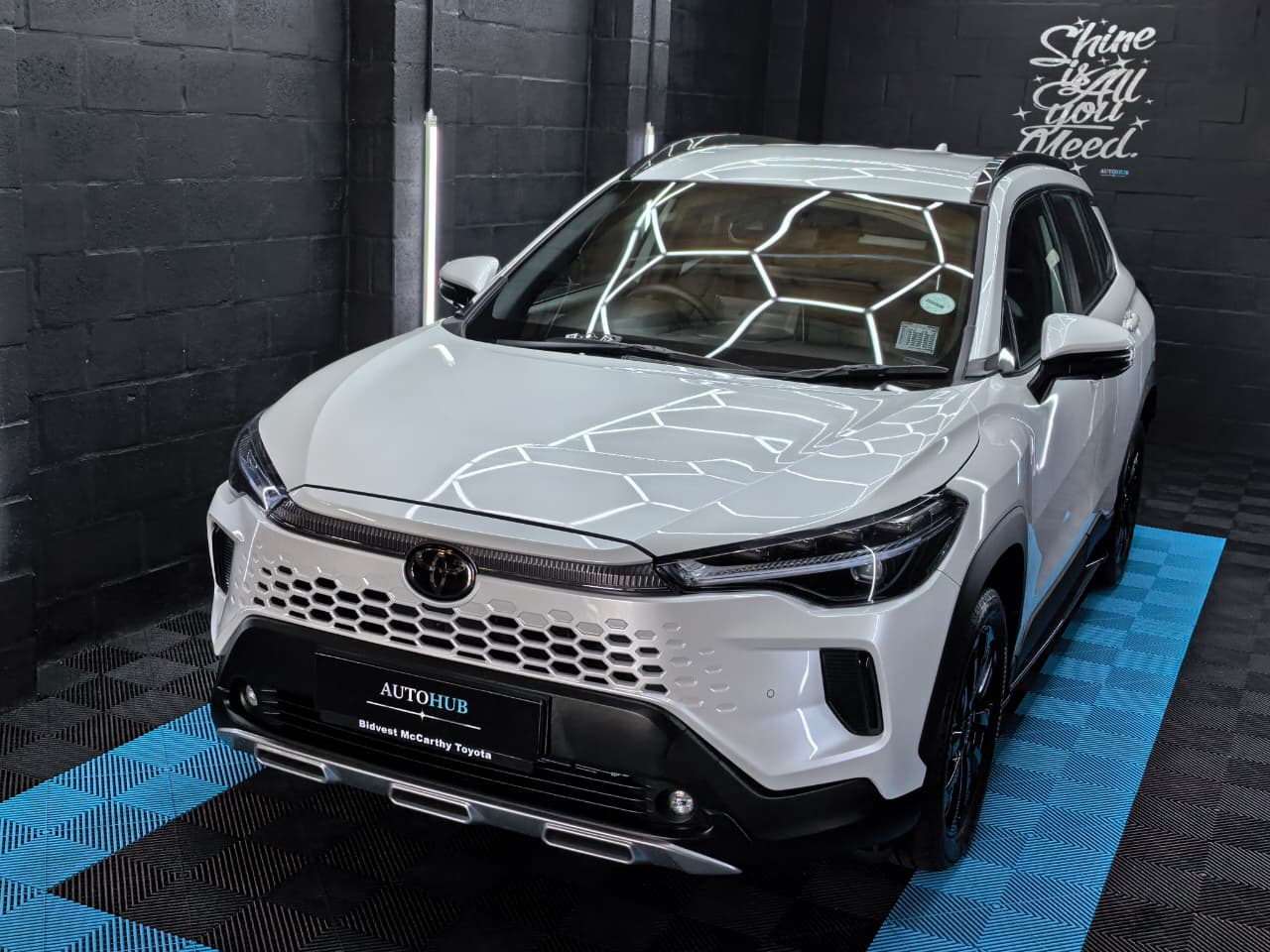 White Toyota SUV front angle after detailing