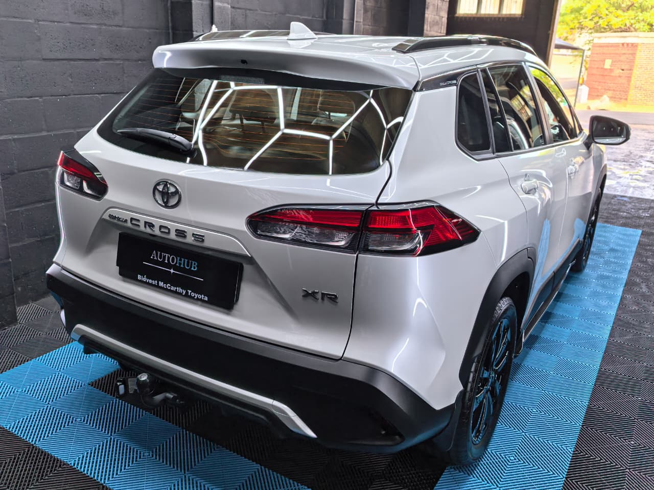 White Toyota SUV rear angle after detailing