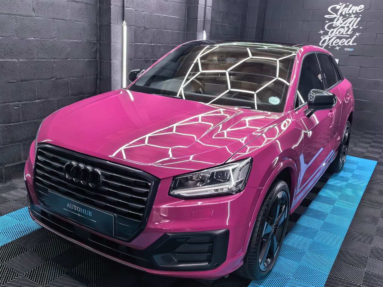 Pink Audi SUV front angle after detailing
