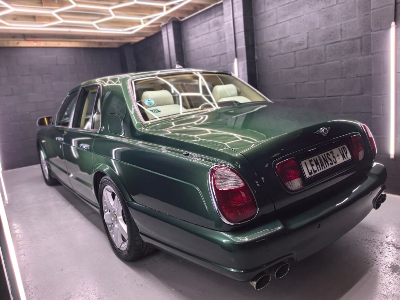 Green Bentley after machine polishing and ceramic coating at AutoHub